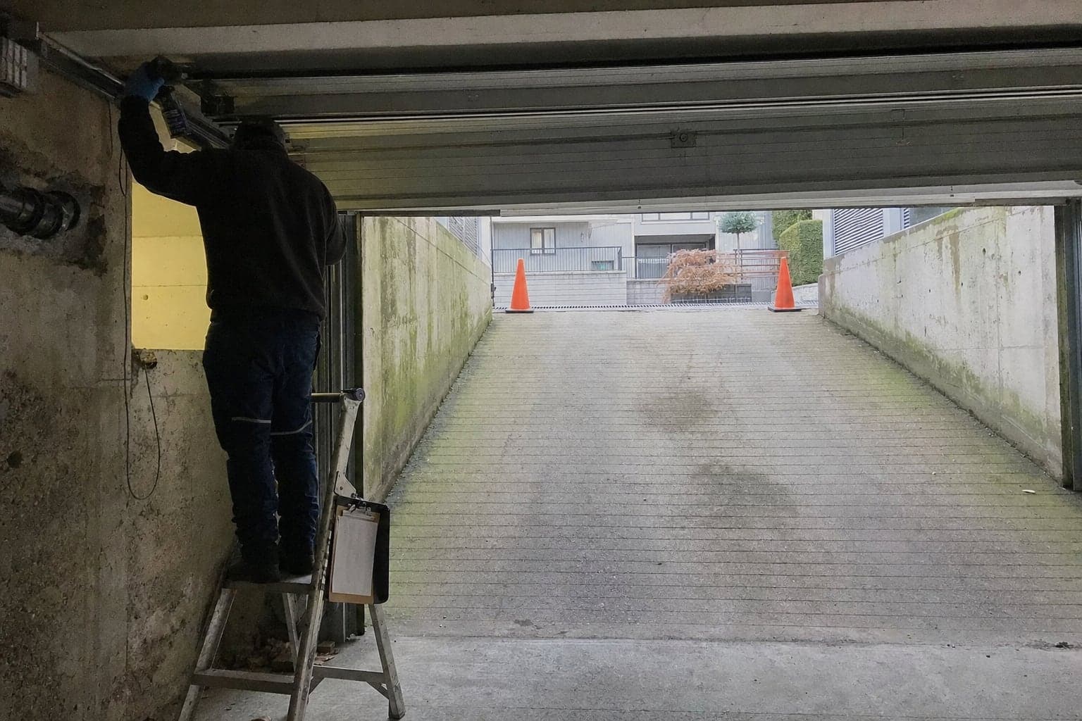 Service check on a strata parkade door