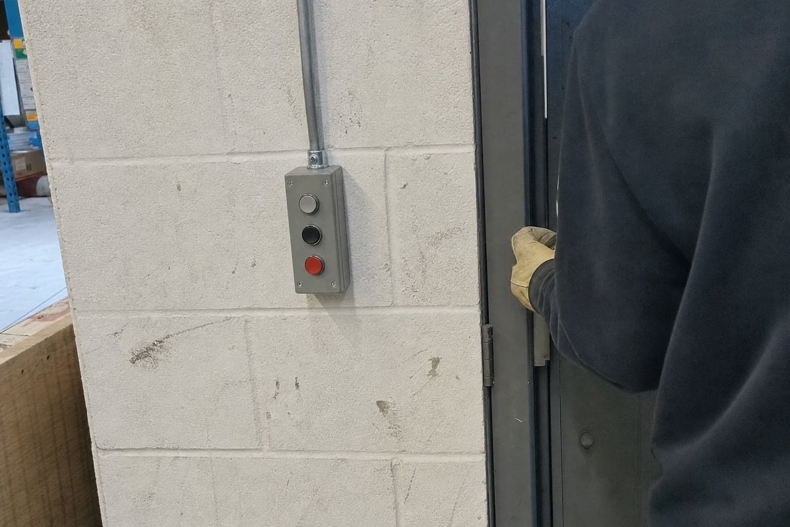 Three-button wall control for a commercial door