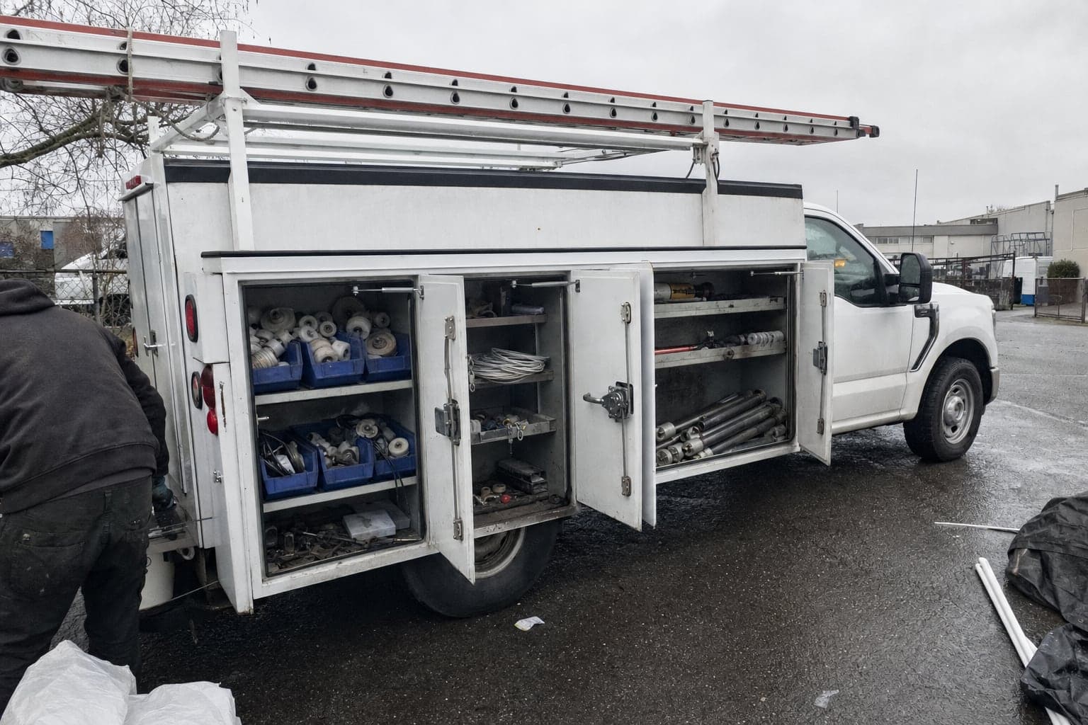 Service truck with ladder racks and spare door parts